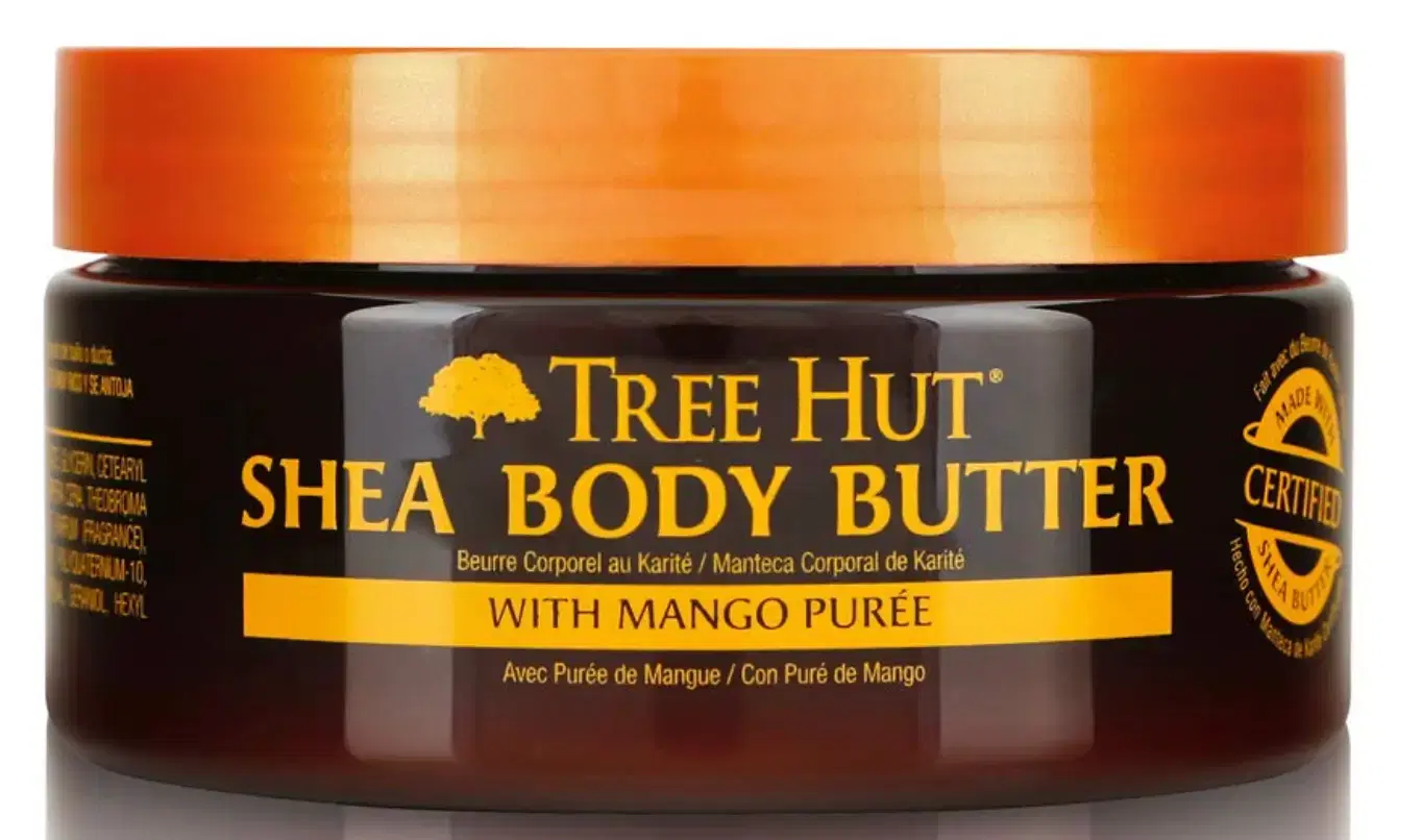 Exfoliating the thighs with a sugar-based body scrub to smooth skin and prep for hair removal