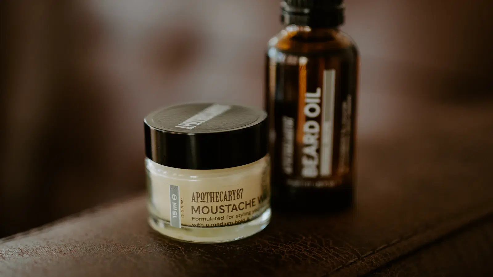 Five shaving creams lined up on a marble bathroom counter — the best shaving cream for the pubic area tested in 2026