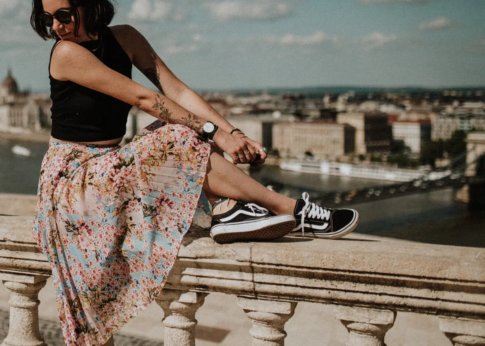 Floral midi skirt worn with black Vans sneakers