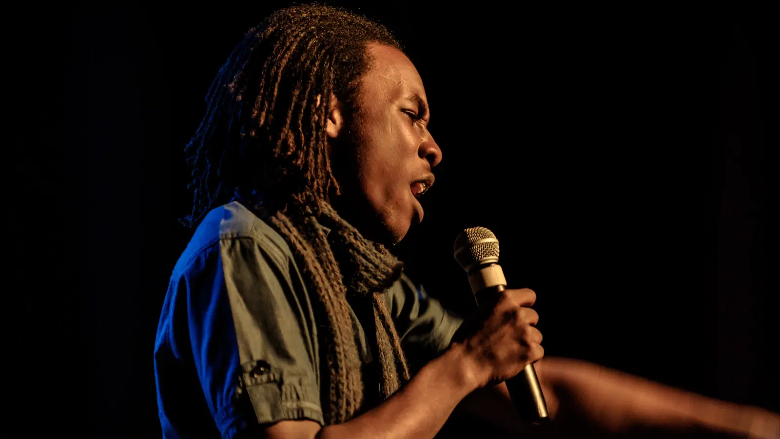 Femboy voice training — 15-minute daily routine with pitch tracker app, notebook, and warm-up exercises laid out on a desk