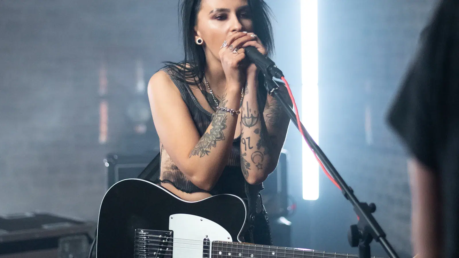 Femboy voice training read-aloud practice — reading from a tablet while recording on a phone, with a pitch tracker app visible