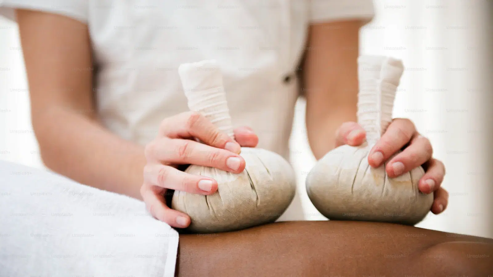 Home wax strips applied to a femboy's thigh — fabric strip pressed flat, hair side up, ready to pull against the grain