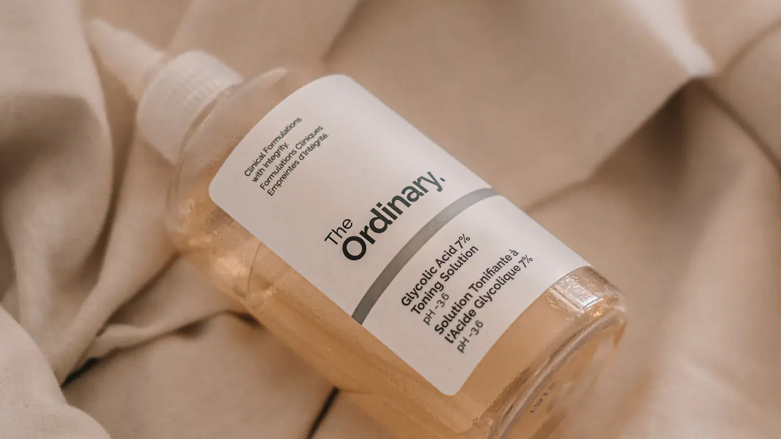 Flat-lay of male hair removal tools — razor, body trimmer, depilatory cream, wax kit, IPL device, and clinic laser brochure arranged on a clean background