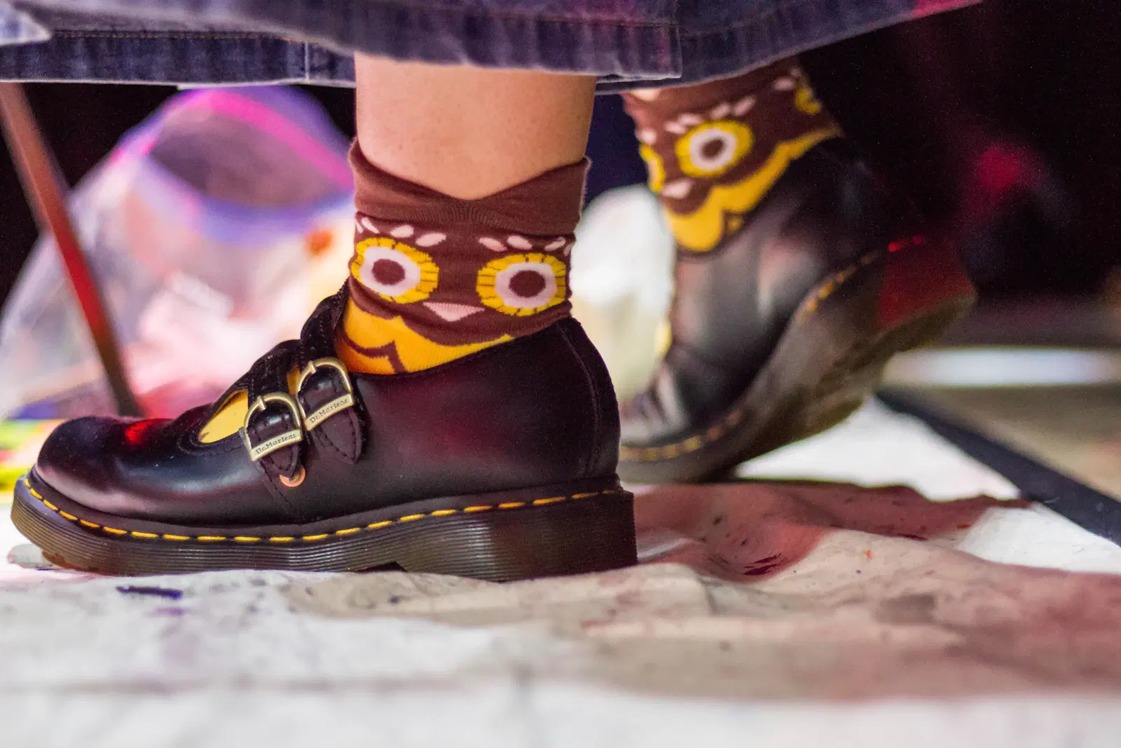 Black buckle shoes worn with brown patterned socks