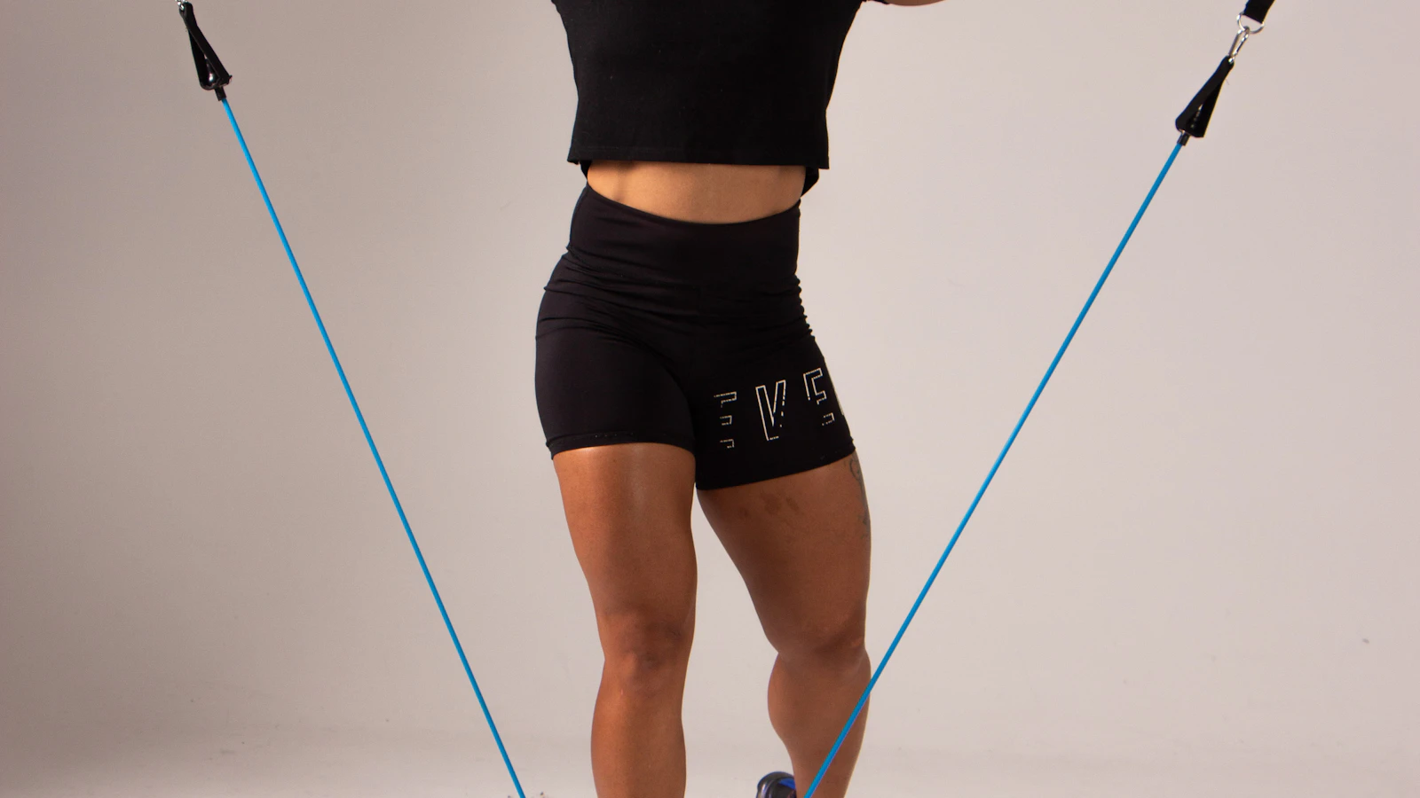 Animated demo of a kettlebell goblet squat — weight held at chest, hips sit below parallel, drive up through the heels to build glute volume